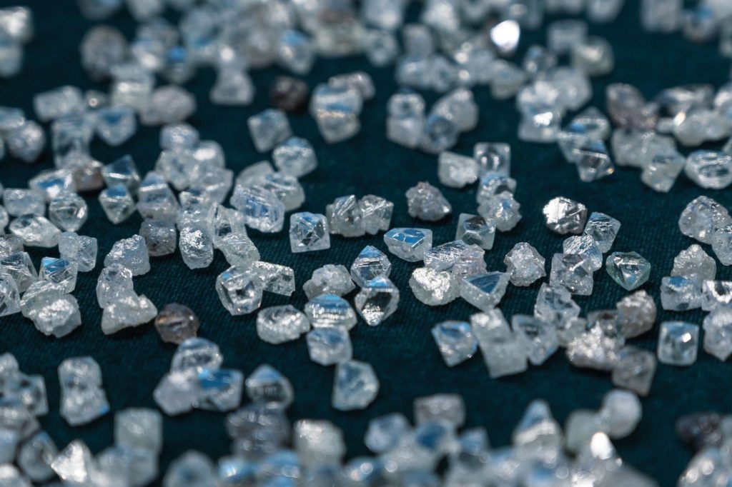 A scattering of small transparent diamonds on velvet.