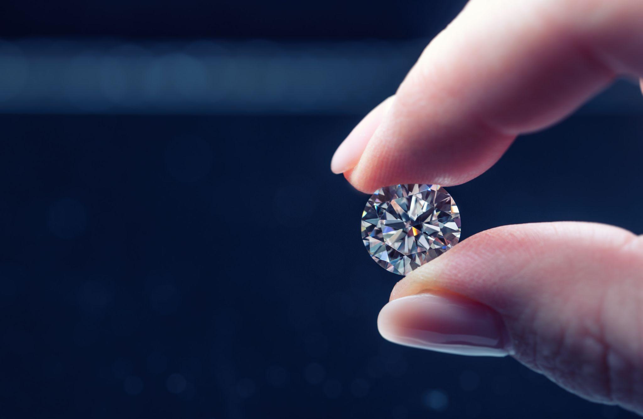 Female hand holding diamond