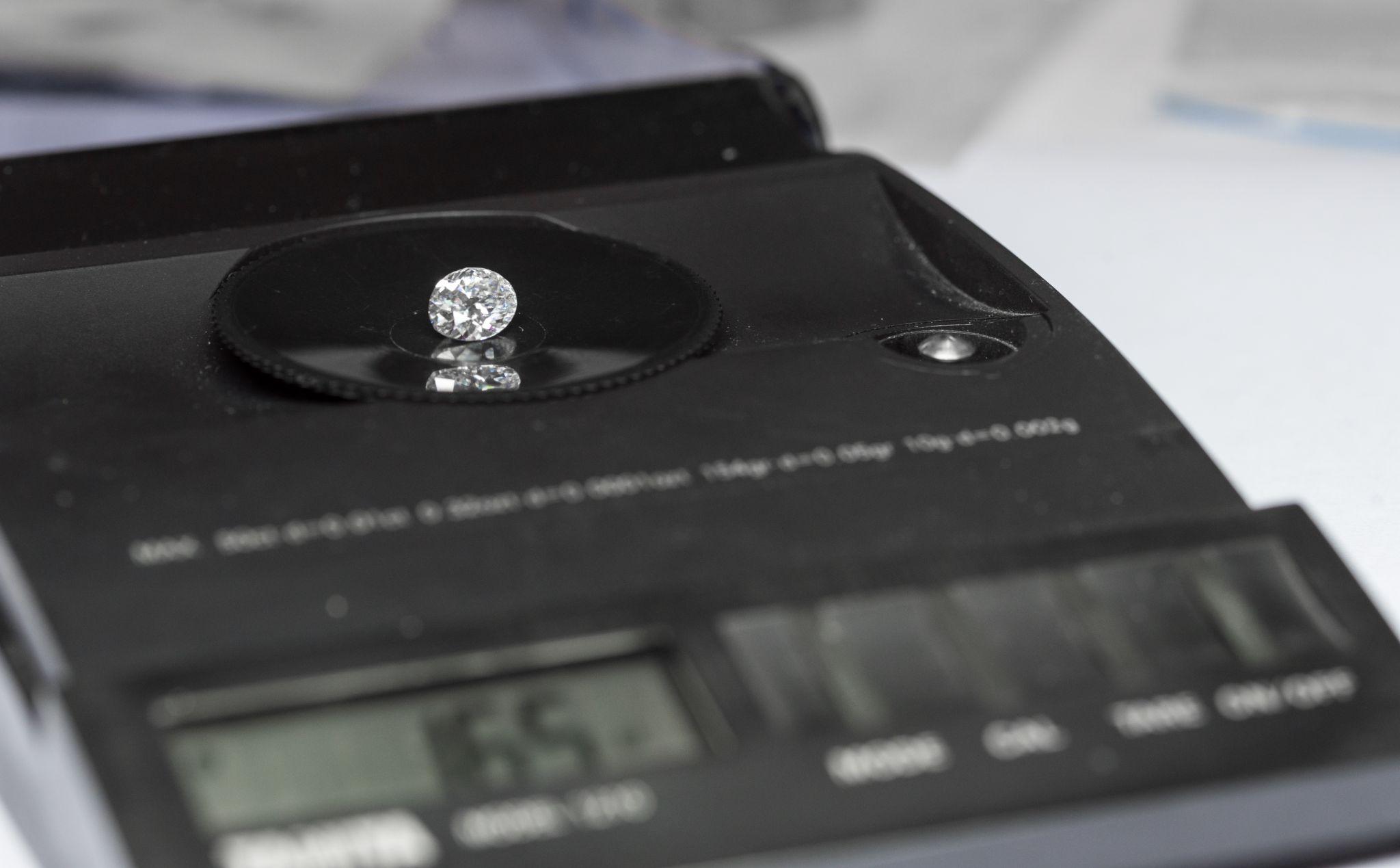 Diamond on a weight scale.