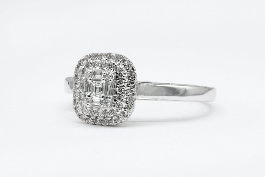 Diamond engagement ring with white background.
