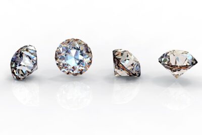Four diamonds of different color grades.